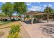 Community park featuring a covered picnic area, grassy lawns, basketball court, and lush greenery for outdoor enjoyment at 277 E Kaibab Dr, Chandler, AZ 85249