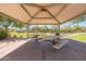 Shaded picnic area with tables, perfect for outdoor dining and gatherings in a community park setting at 277 E Kaibab Dr, Chandler, AZ 85249