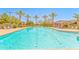 Inviting community pool with palm trees, ample lounging, and clear blue water at 277 E Kaibab Dr, Chandler, AZ 85249