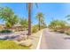 Well-maintained street view of neighborhood with palm trees, landscaping, and sidewalks at 277 E Kaibab Dr, Chandler, AZ 85249
