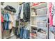 Organized walk-in closet with ample hanging space, shelves, and storage baskets for clothes and accessories at 277 E Kaibab Dr, Chandler, AZ 85249