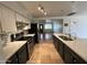 Open-concept kitchen with granite counters, stainless steel appliances, and eat-in island at 2838 E Contessa St, Mesa, AZ 85213