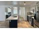 Charming kitchen with granite island, stainless steel appliances, and decorative tile backsplash at 2838 E Contessa St, Mesa, AZ 85213