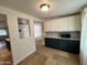 Cozy kitchen features updated cabinets and countertops, stainless microwave, and mosaic backsplash at 2838 E Contessa St, Mesa, AZ 85213