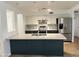 Charming kitchen with granite island, stainless steel appliances, and decorative tile backsplash at 2838 E Contessa St, Mesa, AZ 85213