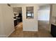 Open-concept kitchen view showcasing eat-in island, backsplash, and open floor plan at 2838 E Contessa St, Mesa, AZ 85213