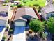 Aerial view of the home, landscaped yard, driveway, and community park at 37252 N Big Bend Rd, San Tan Valley, AZ 85140