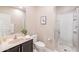 Bathroom features a walk-in shower, vanity, and tile flooring at 37252 N Big Bend Rd, San Tan Valley, AZ 85140