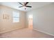 Cozy bedroom features a large window, neutral paint, and plush carpet at 37252 N Big Bend Rd, San Tan Valley, AZ 85140