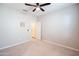 Neutral bedroom with a ceiling fan, carpet, and a closet ready for your touches at 37252 N Big Bend Rd, San Tan Valley, AZ 85140