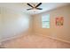 Bright bedroom with neutral walls, carpet, ceiling fan, and window at 37252 N Big Bend Rd, San Tan Valley, AZ 85140