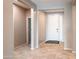 Inviting foyer with neutral color scheme and tile flooring, offering a seamless transition into the home at 37252 N Big Bend Rd, San Tan Valley, AZ 85140