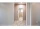 Hallway with tile flooring showing entrance to bathroom at 37252 N Big Bend Rd, San Tan Valley, AZ 85140