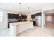 Modern kitchen featuring granite countertops, sleek stainless steel appliances, and dark cabinets at 37252 N Big Bend Rd, San Tan Valley, AZ 85140