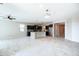 Spacious open-concept kitchen featuring a large island, sleek dark cabinetry, and stainless steel appliances at 37252 N Big Bend Rd, San Tan Valley, AZ 85140