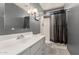This bathroom includes a sink, vanity, commode, and walk-in shower at 3825 W Royal Palm Rd, Phoenix, AZ 85051