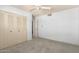 Cozy bedroom with large closet and ceiling fan for added comfort and ample storage at 3825 W Royal Palm Rd, Phoenix, AZ 85051