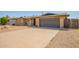 Picture of a single story house with a large driveway, desert landscaping, and an attached garage at 3825 W Royal Palm Rd, Phoenix, AZ 85051