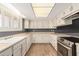 An eat-in kitchen features ample countertop space and white cabinetry at 3825 W Royal Palm Rd, Phoenix, AZ 85051