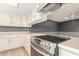 This eat-in kitchen features a stainless range and lots of counter space at 3825 W Royal Palm Rd, Phoenix, AZ 85051