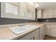 The eat-in kitchen features a double porcelain sink and lots of counter space at 3825 W Royal Palm Rd, Phoenix, AZ 85051