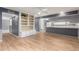 Open-concept layout with ample natural light and hardwood flooring; seamless transition to the kitchen area at 3825 W Royal Palm Rd, Phoenix, AZ 85051