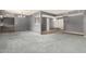 Open-concept layout with carpet in the living room and hardwood flooring in the adjacent space; ample natural light at 3825 W Royal Palm Rd, Phoenix, AZ 85051