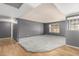 Spacious living room featuring carpet, updated paint, ample natural light, and a smooth transition to hardwood flooring at 3825 W Royal Palm Rd, Phoenix, AZ 85051