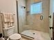 This modern bathroom features a seamless glass shower, light stone pebble floor, and stylish fixtures at 4008 La Ultima Piedra --, Carefree, AZ 85377