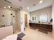 Gorgeous bathroom with standalone tub, glass enclosed shower, and dual sink vanity at 4008 La Ultima Piedra --, Carefree, AZ 85377