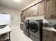 This large laundry room has generous cabinet space and a matching washer and dryer set at 4008 La Ultima Piedra --, Carefree, AZ 85377