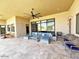 Inviting covered patio with stylish furniture, ceiling fan and multiple seating arrangements at 4008 La Ultima Piedra --, Carefree, AZ 85377