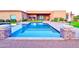 Beautiful pool area with stone accents and vibrant blue water at 4008 La Ultima Piedra --, Carefree, AZ 85377