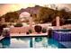 Scenic pool view with desert landscape, rock outcroppings, and mountain views in the background at 4008 La Ultima Piedra --, Carefree, AZ 85377