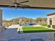 Stunning backyard with pool, spa, artificial turf, and mountain views at 4008 La Ultima Piedra --, Carefree, AZ 85377