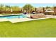 Inviting pool with spa and lush artificial turf, perfect for relaxation and entertainment at 4008 La Ultima Piedra --, Carefree, AZ 85377