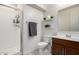 Well-lit bathroom features tile floors, vanity and a walk-in shower at 40213 W James Ln, Maricopa, AZ 85138