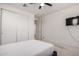 Bright bedroom featuring a ceiling fan, closet, and ample space at 40213 W James Ln, Maricopa, AZ 85138