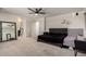 Spacious bedroom featuring plush carpet, a ceiling fan, and neutral decor for a relaxing atmosphere at 40213 W James Ln, Maricopa, AZ 85138