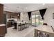 Open concept kitchen and dining area featuring stainless steel appliances and a center island with seating at 40213 W James Ln, Maricopa, AZ 85138