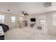 Spacious loft with ample natural light, play area, and stylish ceiling fan at 40213 W James Ln, Maricopa, AZ 85138