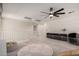 Open loft with a play area, cozy bean bag, and a stylish ceiling fan at 40213 W James Ln, Maricopa, AZ 85138