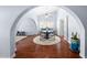 Bright dining area featuring hardwood floors, vaulted ceilings, modern decor, and arched doorways at 4353 W Villa Rita Dr, Glendale, AZ 85308