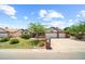 Charming single-story home with brick accents, well-maintained landscaping, and a two-car garage at 4353 W Villa Rita Dr, Glendale, AZ 85308