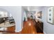 Bright hallway with hardwood floors, arched doorways, designer furniture, and stylish decor at 4353 W Villa Rita Dr, Glendale, AZ 85308