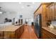 Spacious kitchen view with wooden cabinets, granite countertops and stainless steel appliances at 4353 W Villa Rita Dr, Glendale, AZ 85308