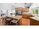 Kitchen view with wooden cabinets, granite countertops, stainless steel appliances, and island seating at 4353 W Villa Rita Dr, Glendale, AZ 85308