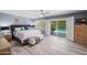 Bright main bedroom with tile flooring, ceiling fan, and glass doors leading to the outdoor pool at 4353 W Villa Rita Dr, Glendale, AZ 85308
