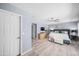 Spacious main bedroom featuring light blue walls, tile floors, walk-in closet, and neutral furnishings at 4353 W Villa Rita Dr, Glendale, AZ 85308