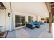 Inviting covered patio with comfortable seating and views of the pool and well-maintained backyard at 4353 W Villa Rita Dr, Glendale, AZ 85308